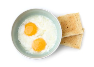 Photo of Half-boiled eggs in bowl and toasts isolated on white, top view. Traditional asian breakfast