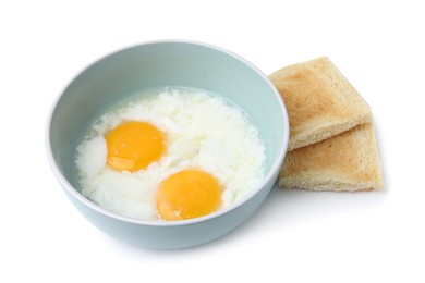 Photo of Half-boiled eggs in bowl and toasts isolated on white. Traditional asian breakfast