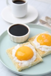 Photo of Tasty kaya toasts with half-boiled eggs served on table, closeup. Traditional asian breakfast