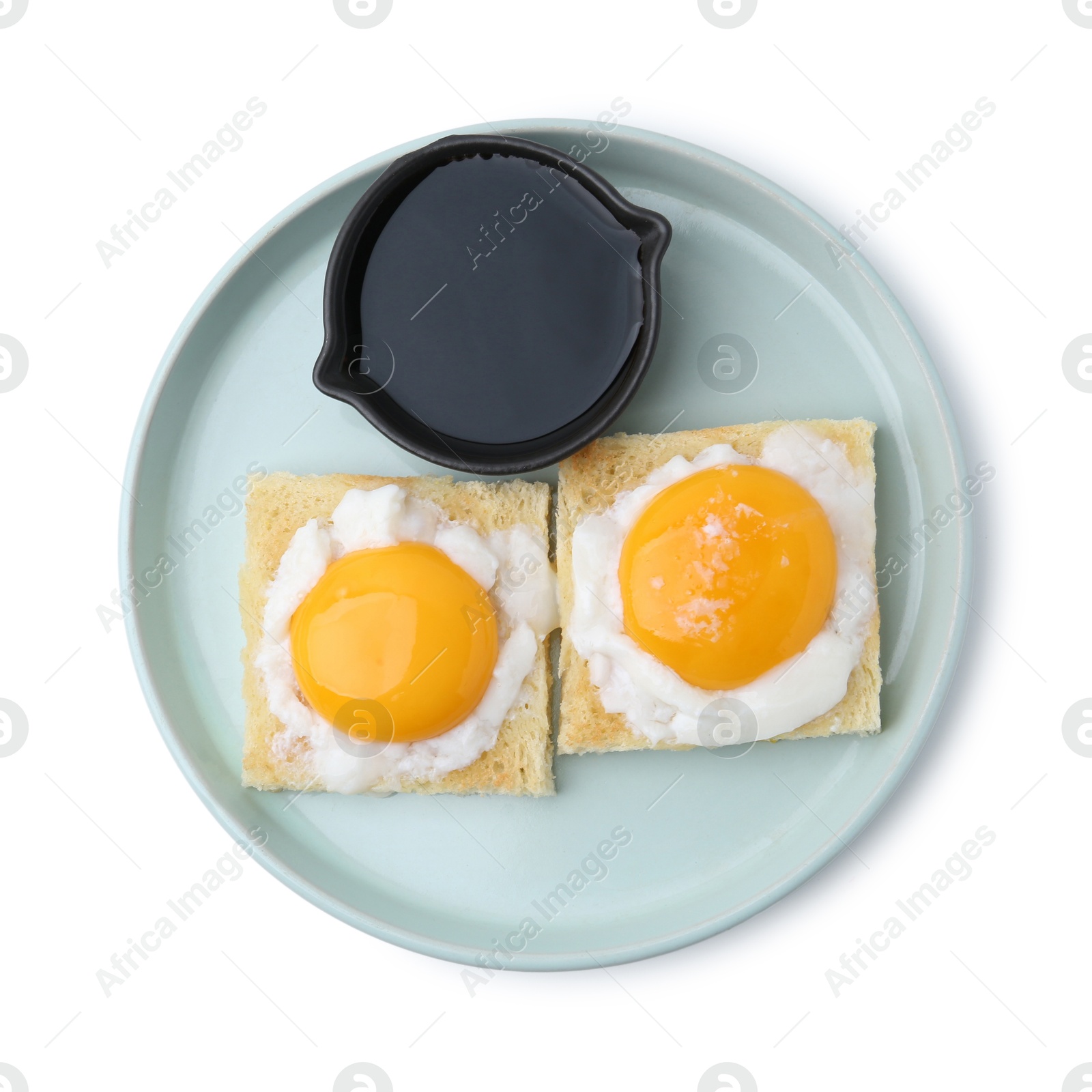 Tasty kaya toasts with half-boiled eggs and soy sauce isolated on white, top view. Traditional asian breakfast Photo of Tasty kaya toasts with half-boiled eggs and soy sauce isolated on white, top view. Traditional asian breakfast