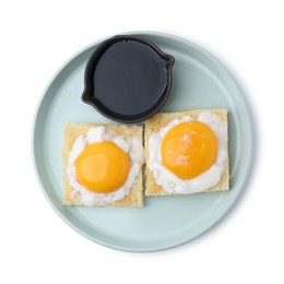 Photo of Tasty kaya toasts with half-boiled eggs and soy sauce isolated on white, top view. Traditional asian breakfast