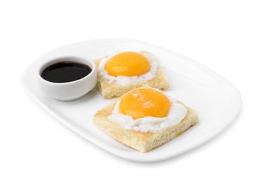 Photo of Tasty kaya toasts with half-boiled eggs and soy sauce isolated on white. Traditional asian breakfast