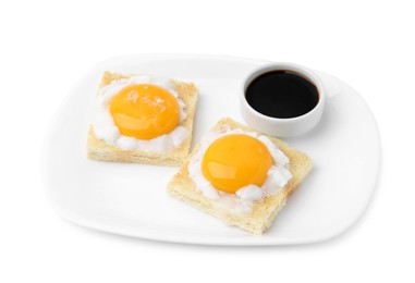 Photo of Tasty kaya toasts with half-boiled eggs and soy sauce isolated on white. Traditional asian breakfast