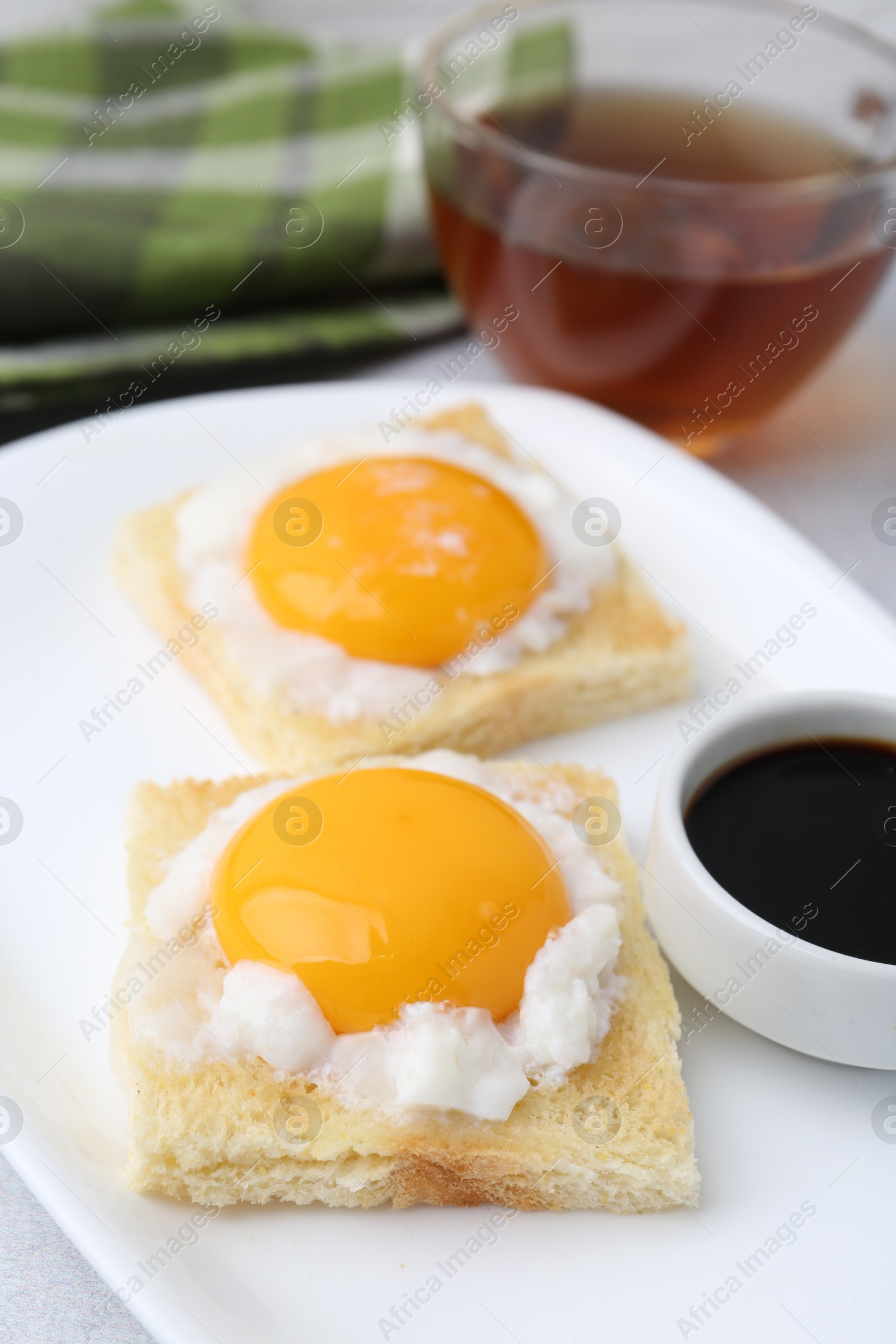 Tasty kaya toasts with half-boiled eggs served on table, closeup. Traditional asian breakfast Photo of Tasty kaya toasts with half-boiled eggs served on table, closeup. Traditional asian breakfast