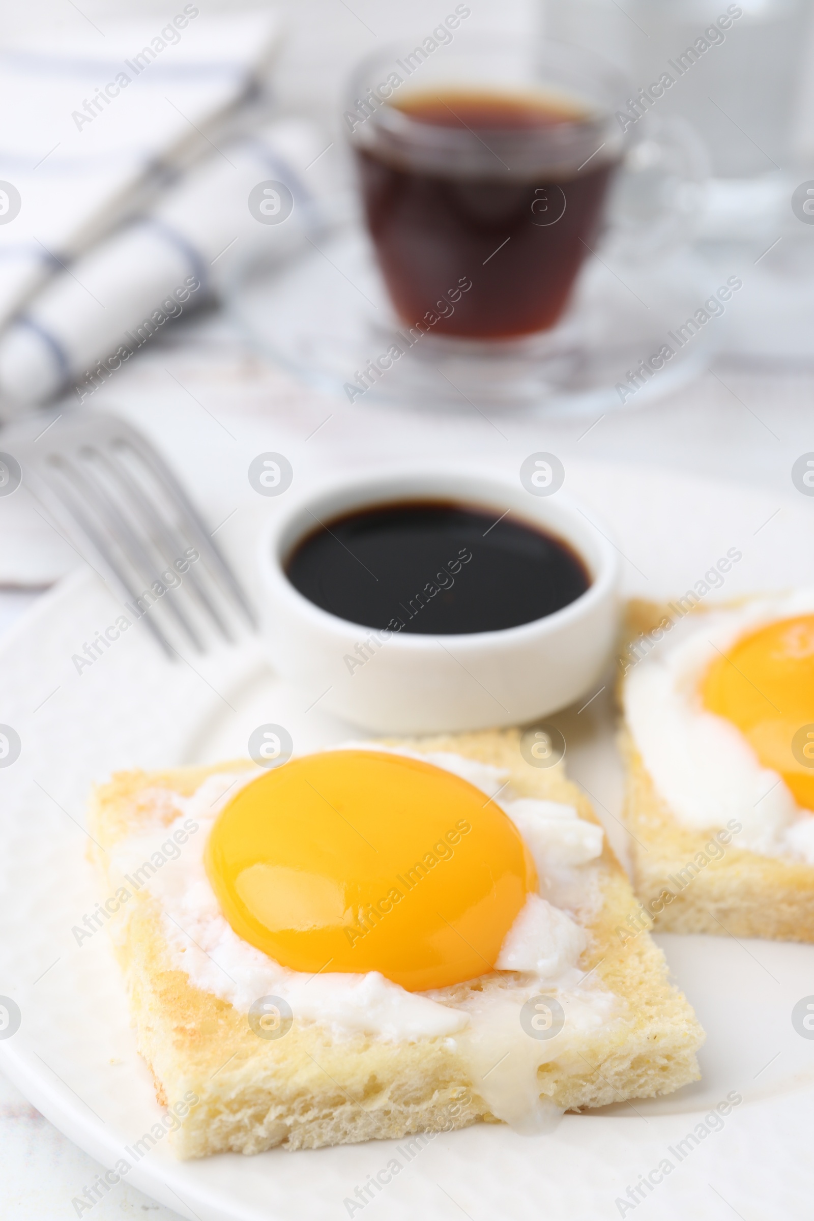 Tasty kaya toasts with half-boiled eggs served on table, closeup. Traditional asian breakfast Photo of Tasty kaya toasts with half-boiled eggs served on table, closeup. Traditional asian breakfast