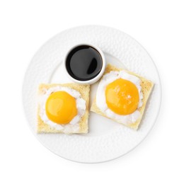 Photo of Tasty kaya toasts with half-boiled eggs and soy sauce isolated on white, top view. Traditional asian breakfast