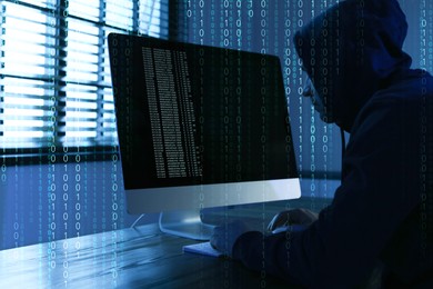 Image of Cyber attack. Hacker working on computer at table in dark room. Binary code around him