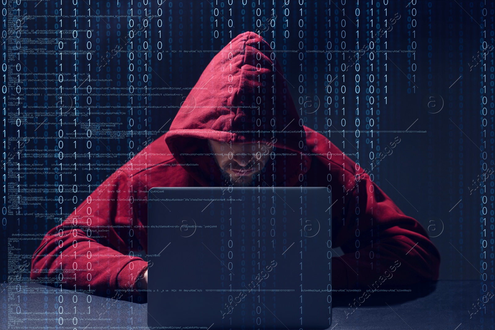 Cyber attack. Hacker working on laptop against dark background. Digital codes around him Image of Cyber attack. Hacker working on laptop against dark background. Digital codes around him