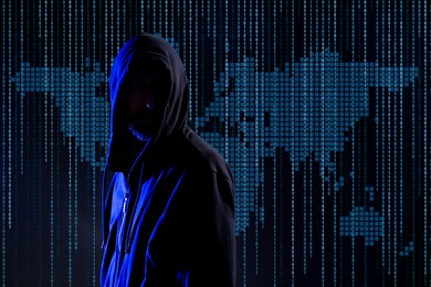Image of Cyber attack. Anonymous hacker against virtual world map and binary code