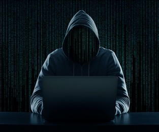 Image of Cyber attack. Anonymous hacker working on laptop at table. Digital code instead of his head