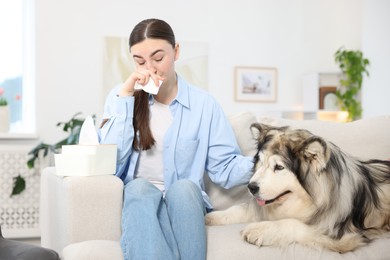 Photo of Woman suffering from allergy with her dog at home