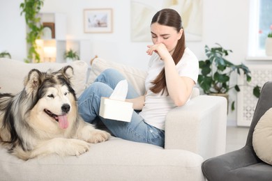 Photo of Woman suffering from allergy with her dog at home
