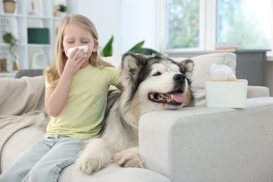 Photo of Girl suffering from allergy with her dog at home