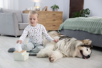 Photo of Girl suffering from allergy with her dog at home