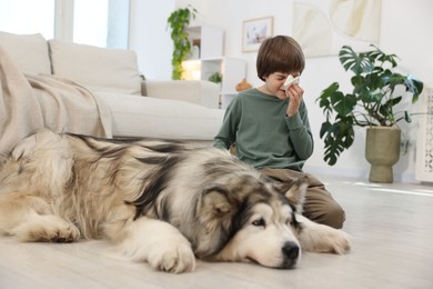 Photo of Boy suffering from allergy with her dog at home