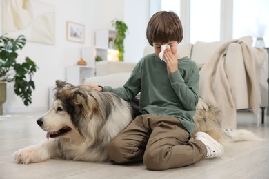 Photo of Boy suffering from allergy with her dog at home