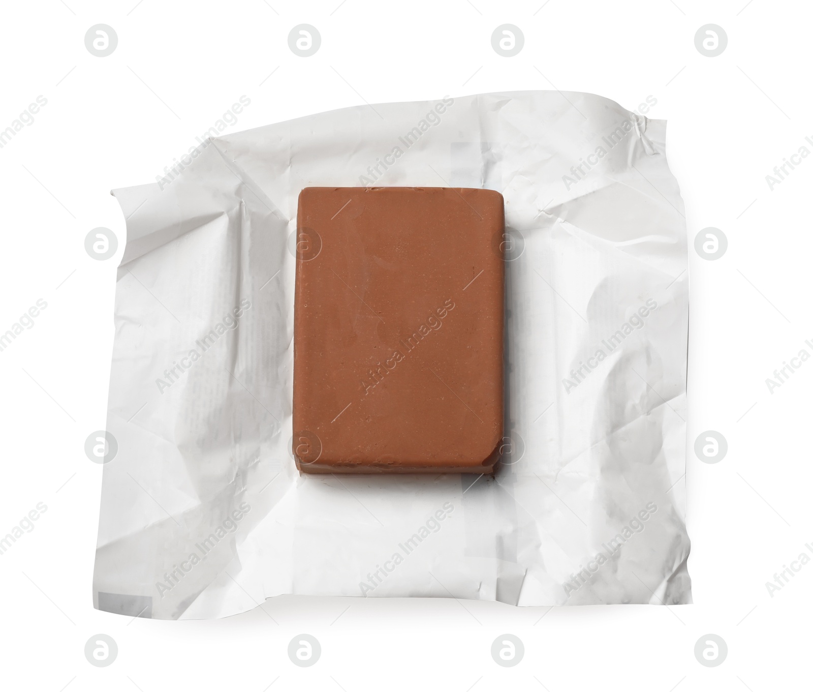 Block of tasty chocolate butter in open package isolated on white, top view Photo of Block of tasty chocolate butter in open package isolated on white, top view