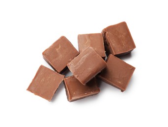 Photo of Pieces of tasty chocolate butter isolated on white, top view