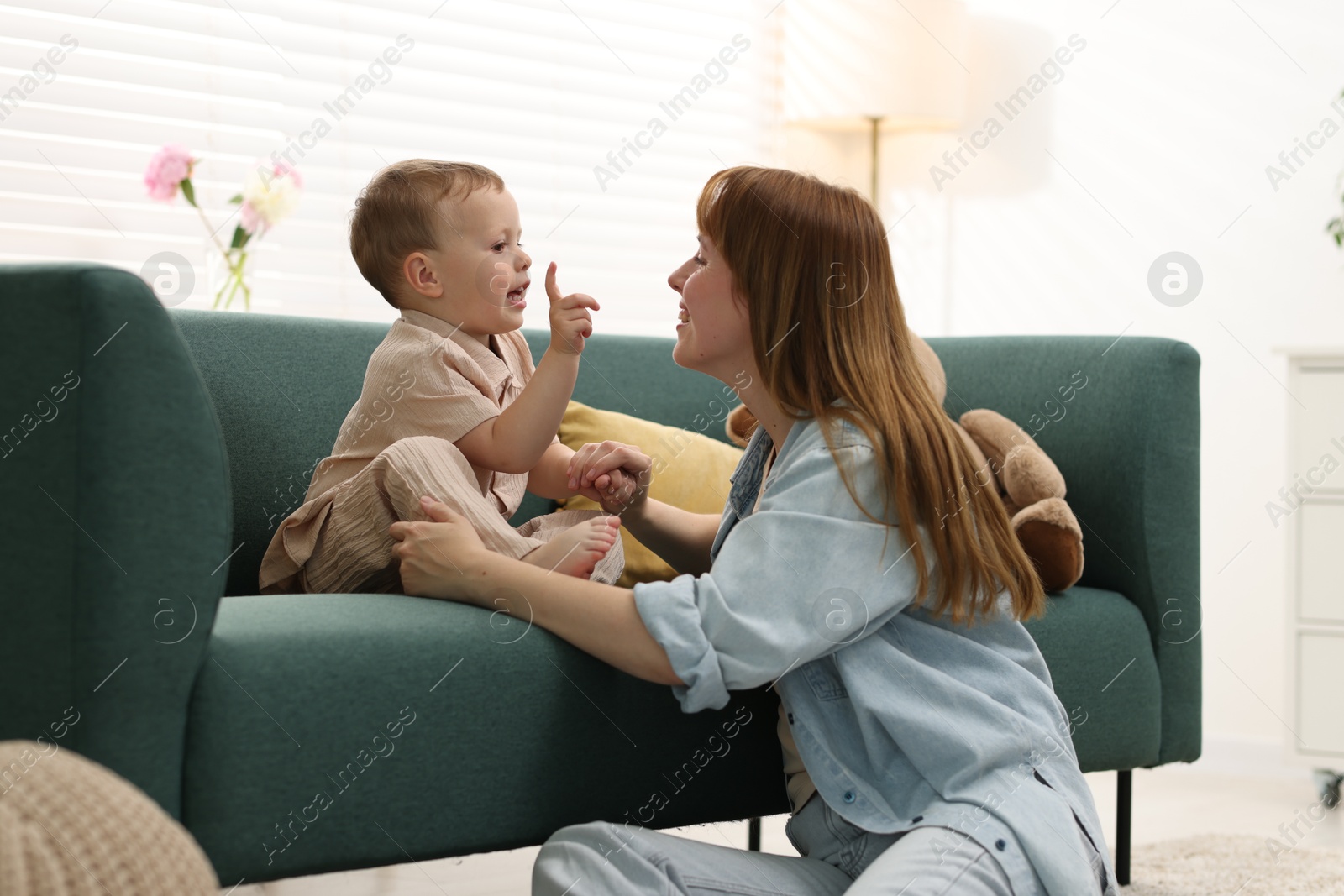 Happy mother spending time together with her son at home Photo of Happy mother spending time together with her son at home
