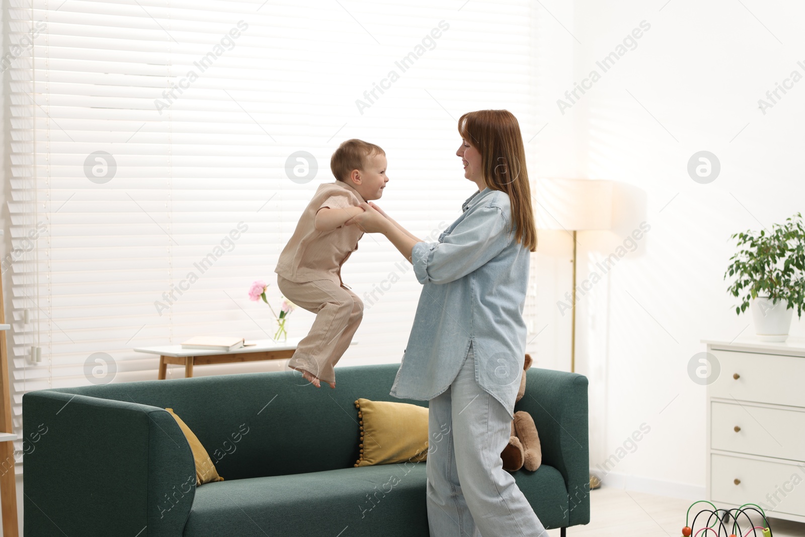 Happy mother spending time together with her son at home Photo of Happy mother spending time together with her son at home