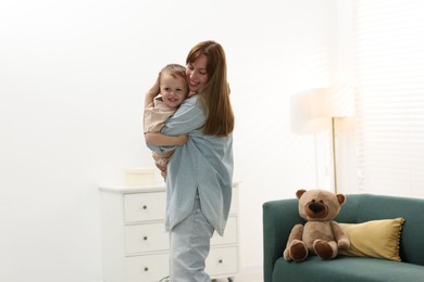 Photo of Happy mother spending time together with her son at home