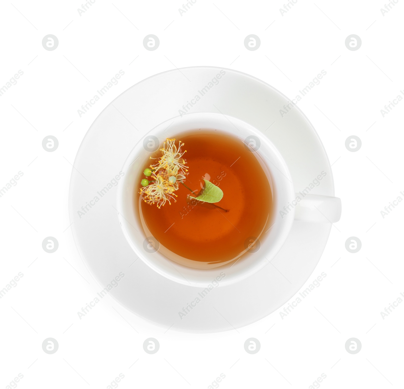 Tasty linden tea in cup, leaves and flowers isolated on white, top view Photo of Tasty linden tea in cup, leaves and flowers isolated on white, top view