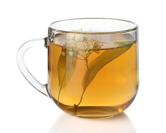 Photo of Tasty linden tea in cup, leaves and flowers isolated on white