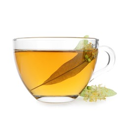 Photo of Tasty linden tea in cup, leaves and flowers isolated on white