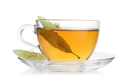 Photo of Tasty linden tea in cup, leaves and flowers isolated on white