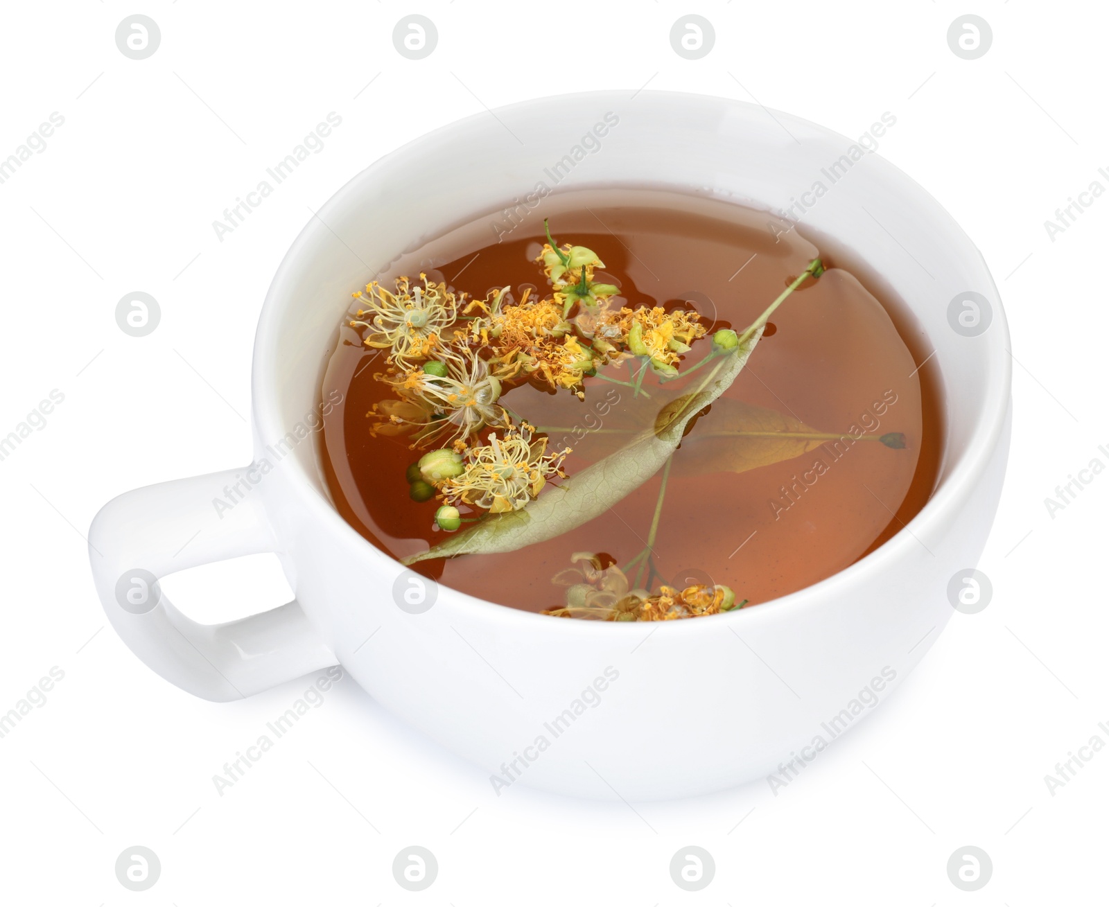 Photo of Tasty linden tea in cup, leaves and flowers isolated on white