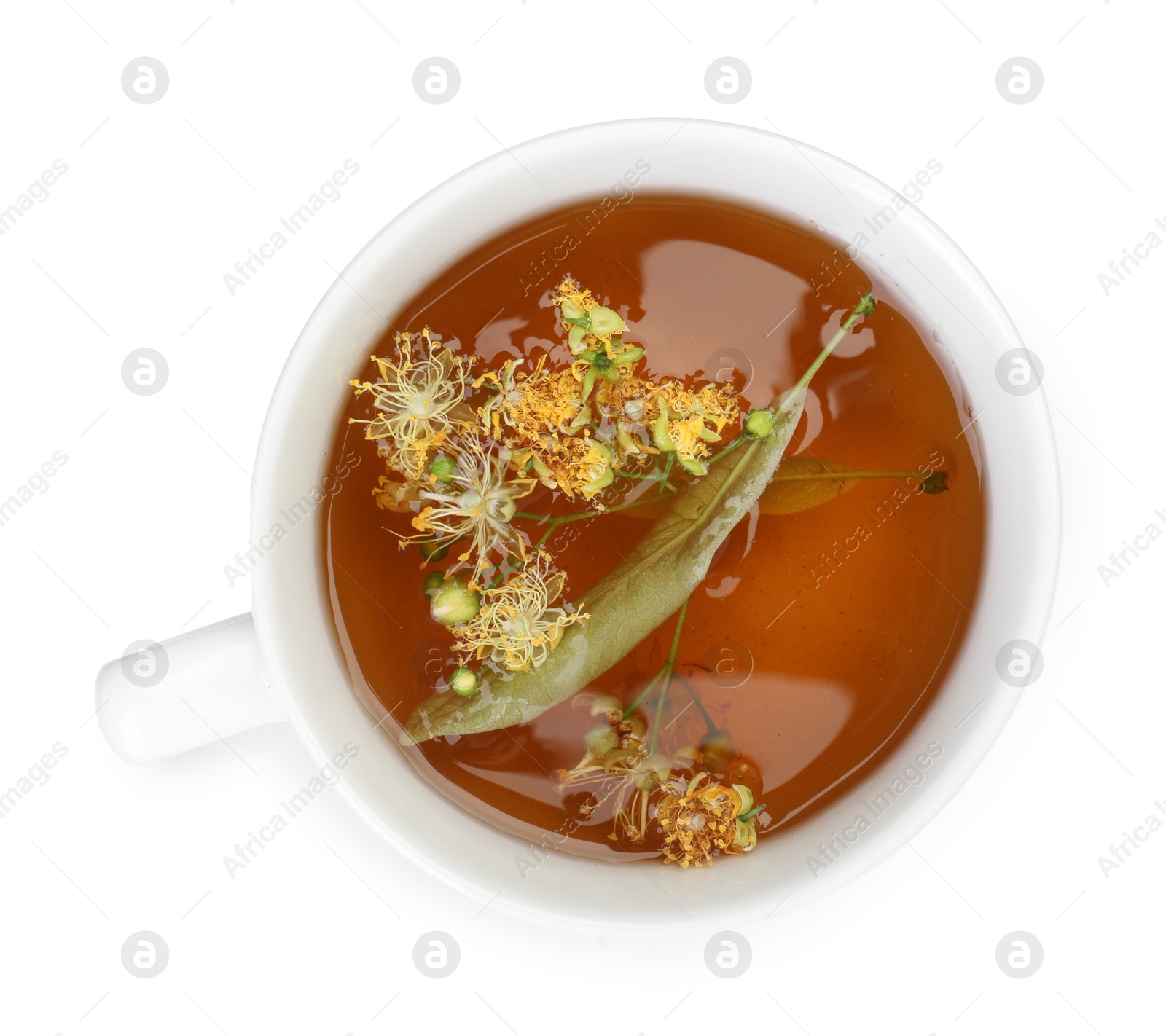 Tasty linden tea in cup, leaves and flowers isolated on white, top view Photo of Tasty linden tea in cup, leaves and flowers isolated on white, top view