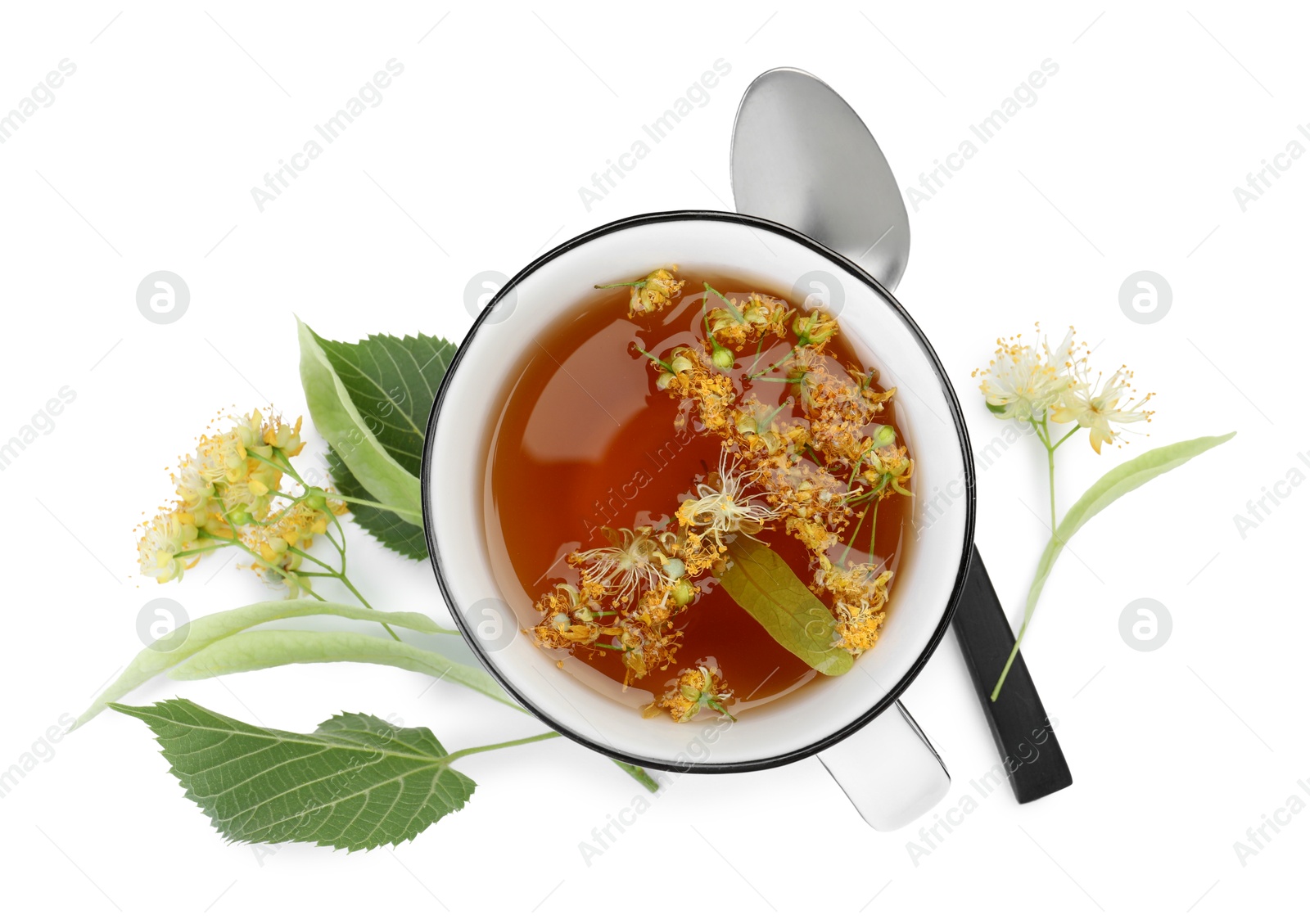 Tasty linden tea in cup, leaves and flowers isolated on white, top view Photo of Tasty linden tea in cup, leaves and flowers isolated on white, top view