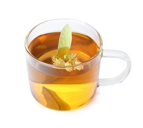 Photo of Tasty linden tea in cup, leaves and flowers isolated on white