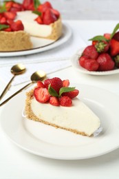 Photo of Delicious cheesecake with strawberries and mint on white wooden table, closeup