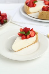 Photo of Piece of tasty cheesecake with strawberries and mint on white wooden table, closeup
