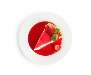Photo of Piece of tasty cheesecake with strawberries, sauce and mint isolated on white, top view