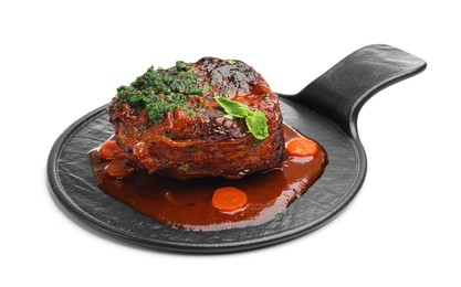 Photo of Traditional ossobuco dish with beef steak, sauce and vegetables isolated on white