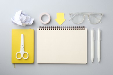 Photo of Flat lay composition with notebooks on gray background