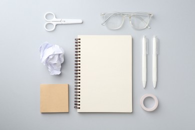 Photo of Flat lay composition with notebook on gray background