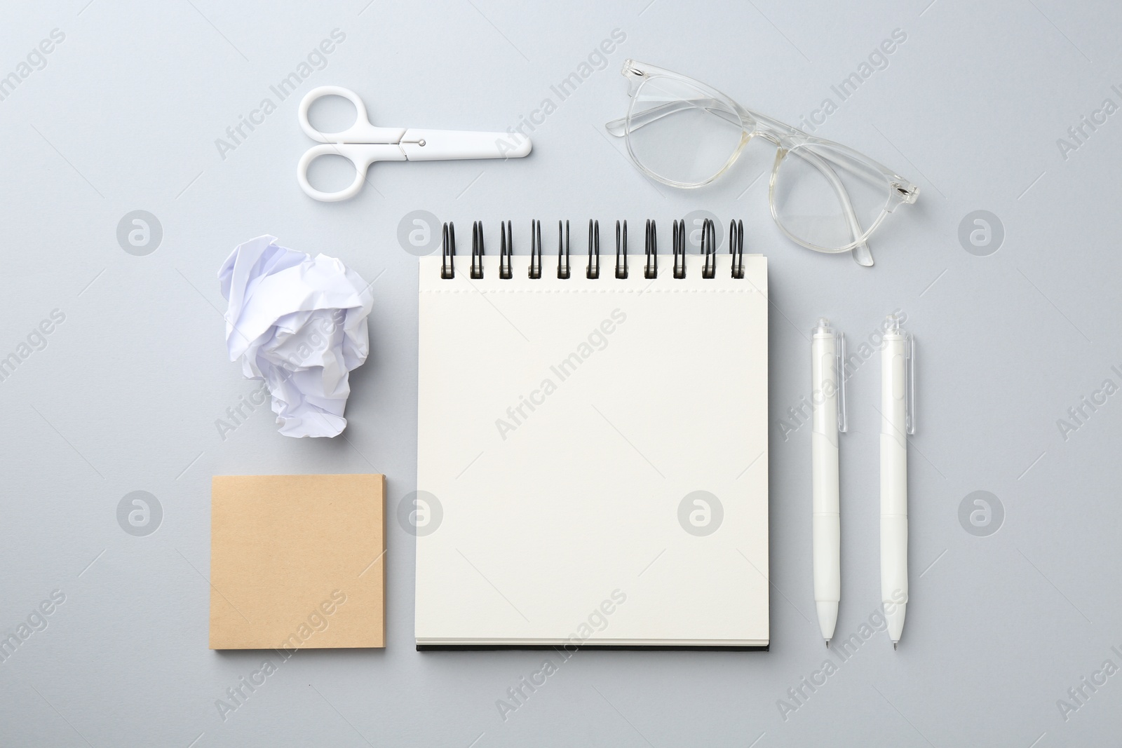 Photo of Flat lay composition with notebook on gray background