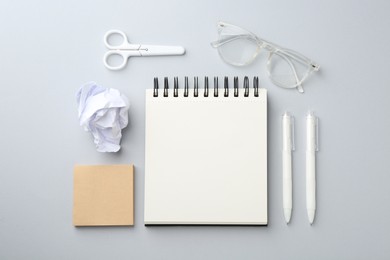 Photo of Flat lay composition with notebook on gray background
