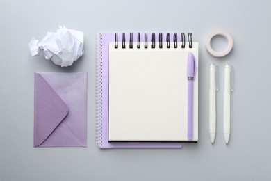 Photo of Flat lay composition with notebook on gray background