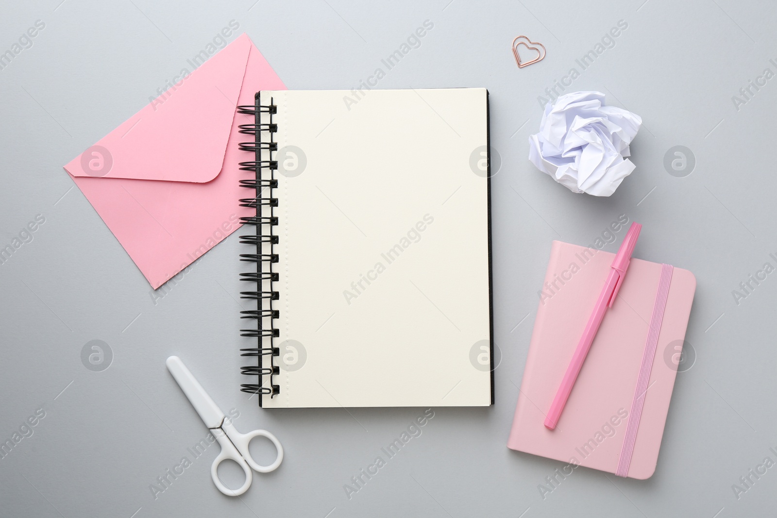 Photo of Flat lay composition with notebooks on gray background