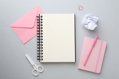 Photo of Flat lay composition with notebooks on gray background