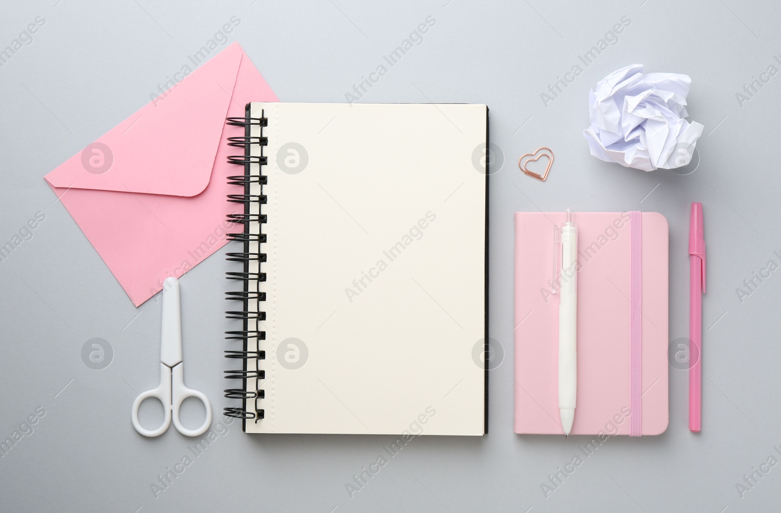 Photo of Flat lay composition with notebooks on gray background