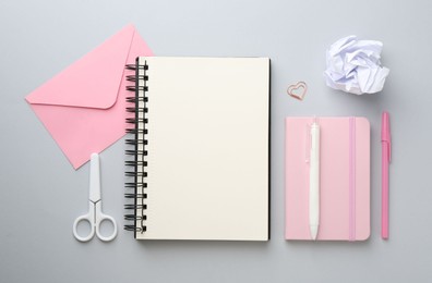 Photo of Flat lay composition with notebooks on gray background