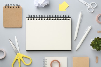 Photo of Flat lay composition with notebooks on gray background