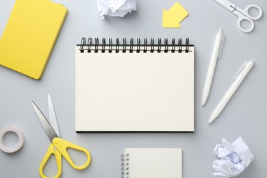 Photo of Flat lay composition with notebooks on gray background