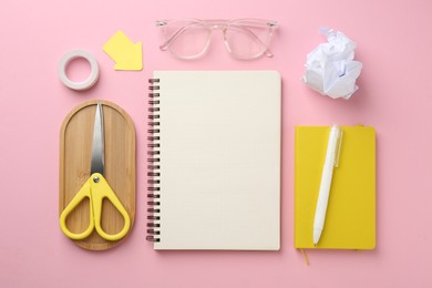 Photo of Flat lay composition with notebooks on pink background