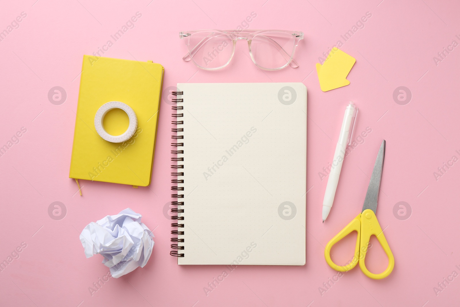 Photo of Flat lay composition with notebooks on pink background